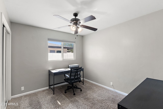 office area featuring ceiling fan, baseboards, and carpet floors