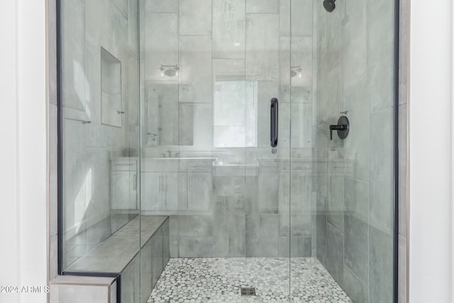 bathroom featuring an enclosed shower