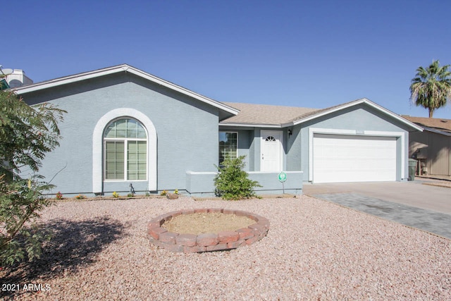 ranch-style home with a garage