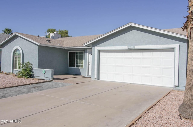 ranch-style house featuring a garage