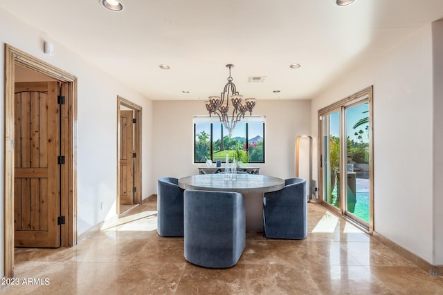 dining room with an inviting chandelier and a wealth of natural light