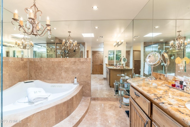 bathroom featuring a relaxing tiled tub and vanity