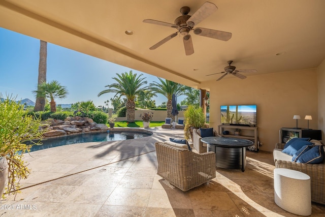 view of patio featuring ceiling fan