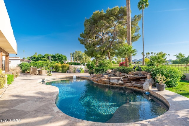 view of pool featuring a patio area