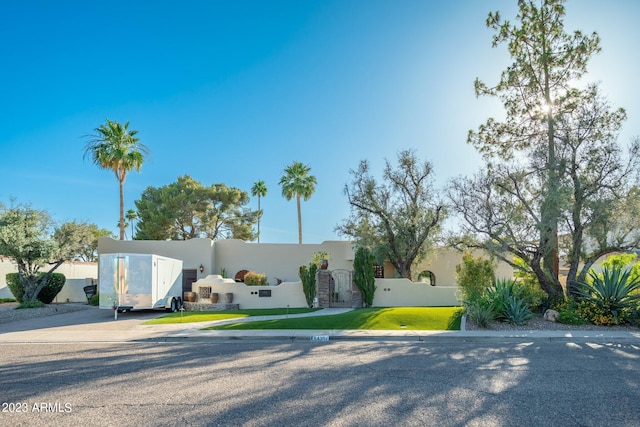 view of front of home with a front lawn