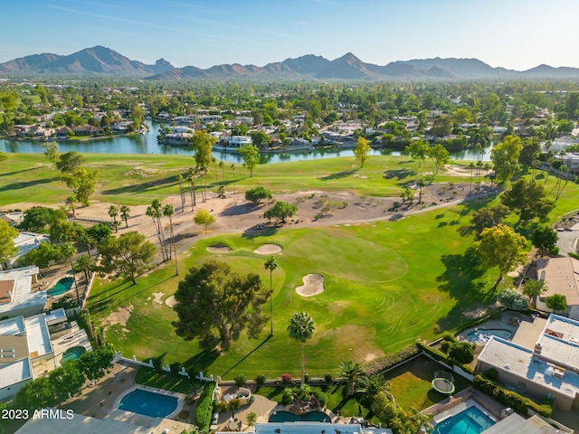 aerial view featuring a water and mountain view