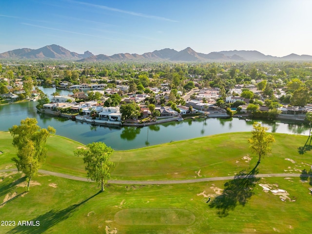 birds eye view of property featuring a water and mountain view