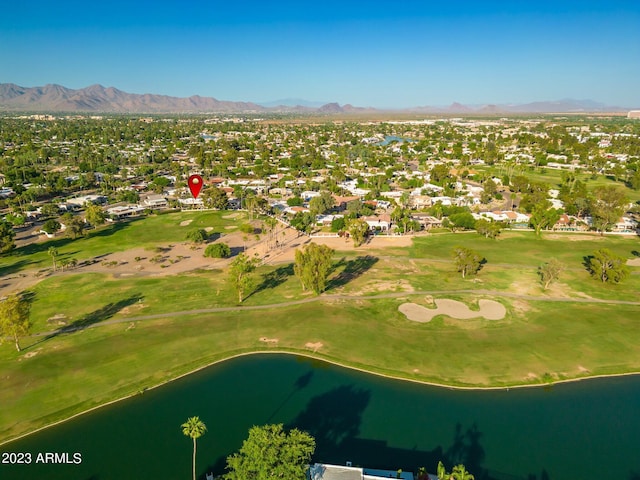 drone / aerial view with a water and mountain view