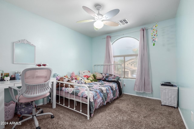 carpeted bedroom featuring multiple windows and ceiling fan