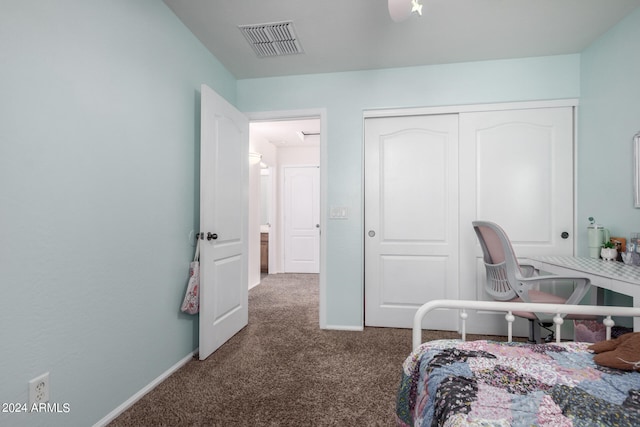 carpeted bedroom featuring a closet