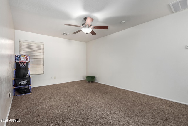 empty room with carpet flooring and ceiling fan