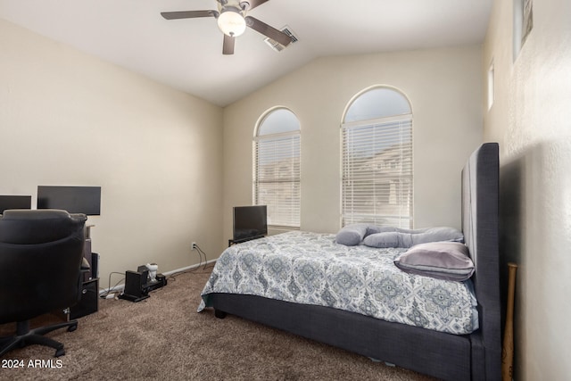 bedroom with ceiling fan, lofted ceiling, and carpet