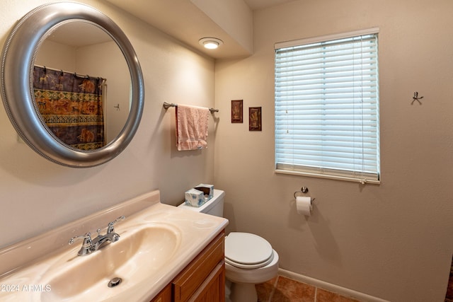 bathroom with tile patterned floors, vanity, a shower with shower curtain, and toilet