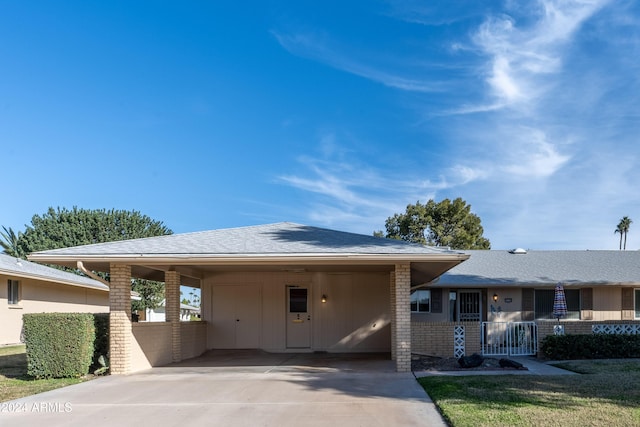 view of front of property with a carport and a porch