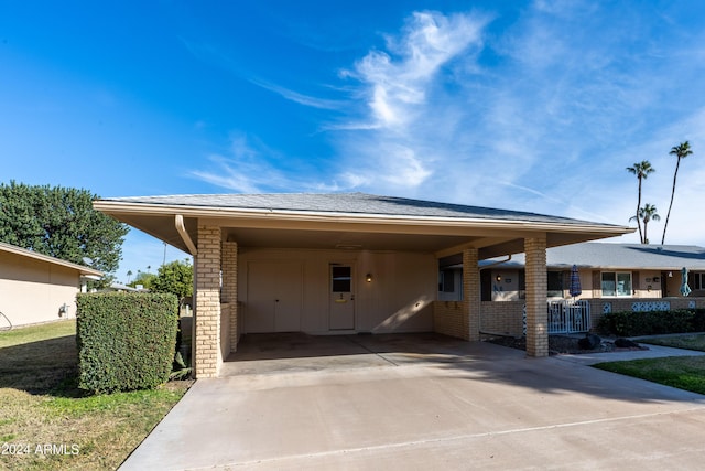 exterior space with a carport