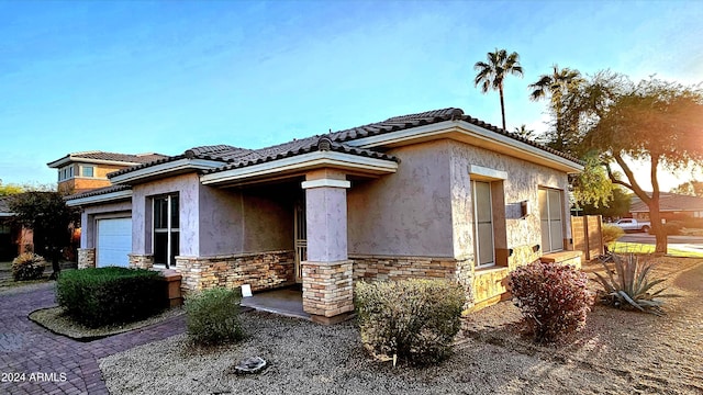 view of front of property with a garage