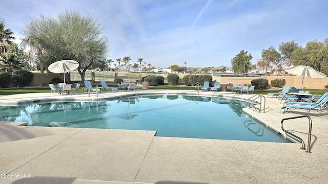 view of swimming pool featuring a patio