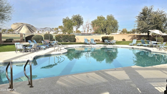 view of swimming pool with a patio area