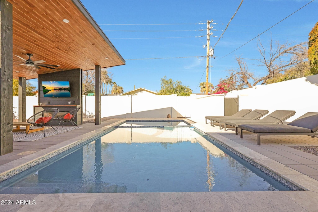 view of pool featuring a patio and ceiling fan