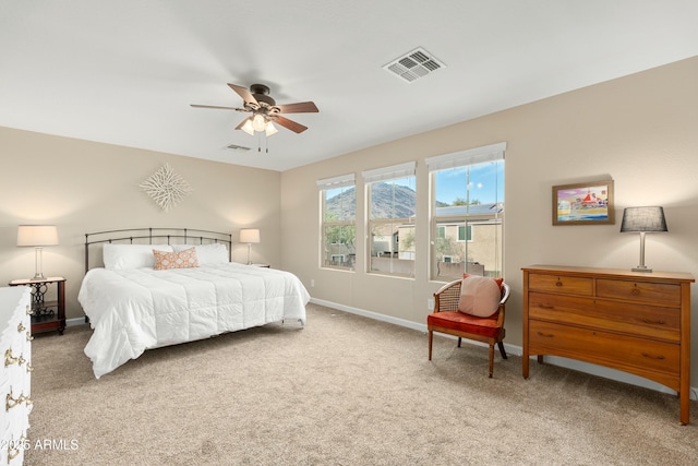 bedroom with ceiling fan and carpet floors