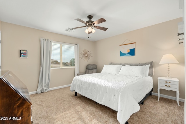 bedroom featuring light colored carpet and ceiling fan