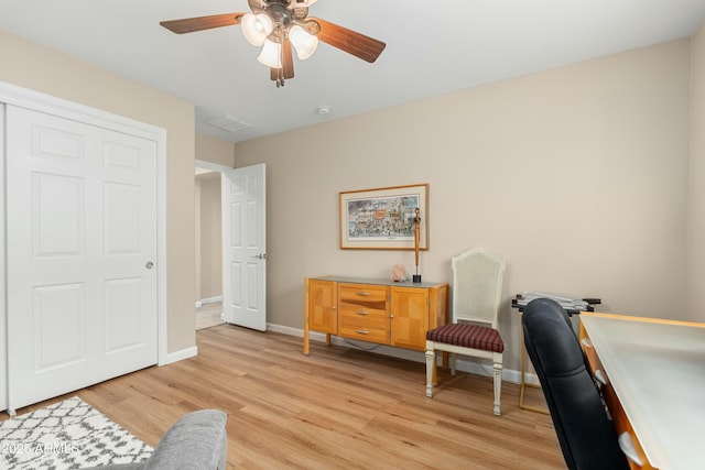 sitting room with ceiling fan and light hardwood / wood-style floors