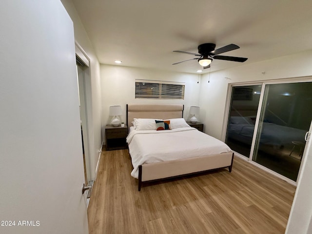 bedroom featuring access to exterior, ceiling fan, and light hardwood / wood-style flooring