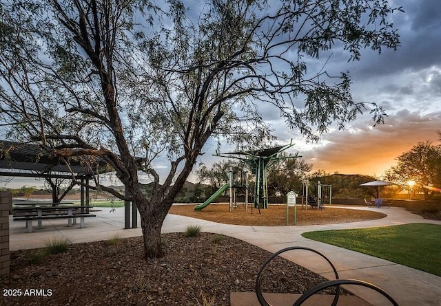 view of community with a playground and a yard