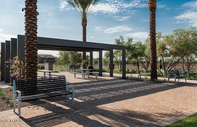 view of community featuring a pergola and a patio