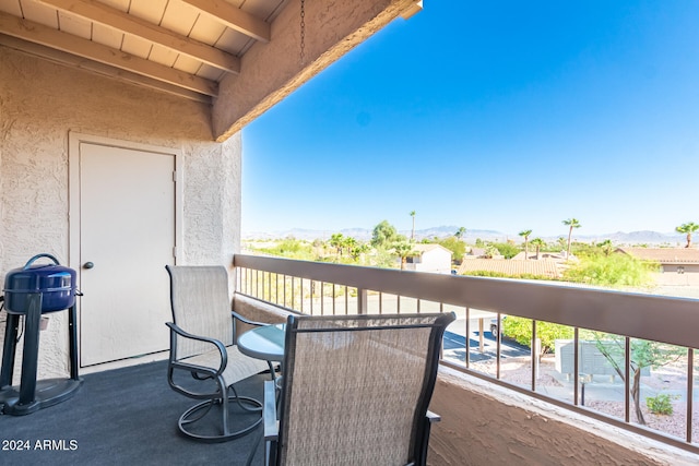 balcony featuring a mountain view