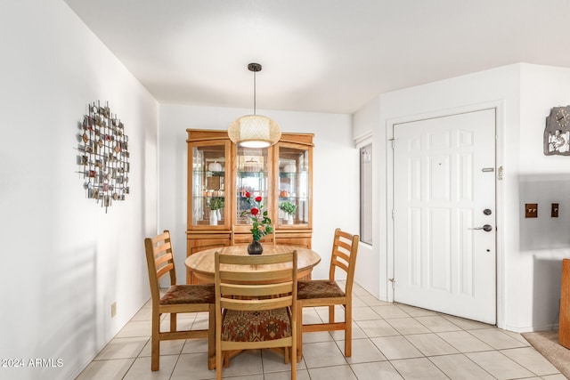 dining area with light tile patterned floors