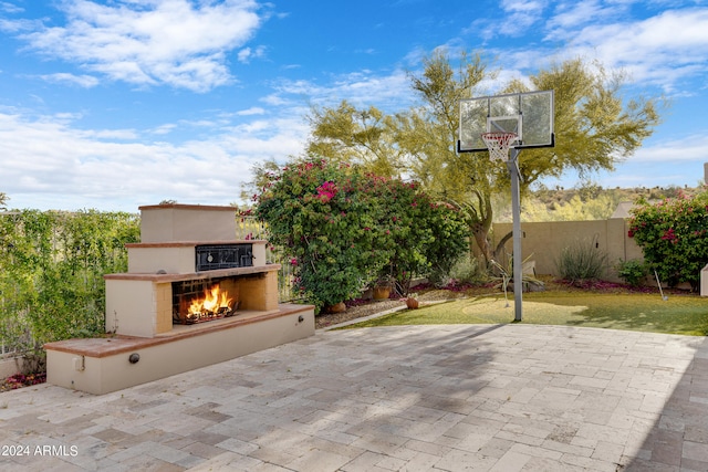 view of patio / terrace with an outdoor fireplace