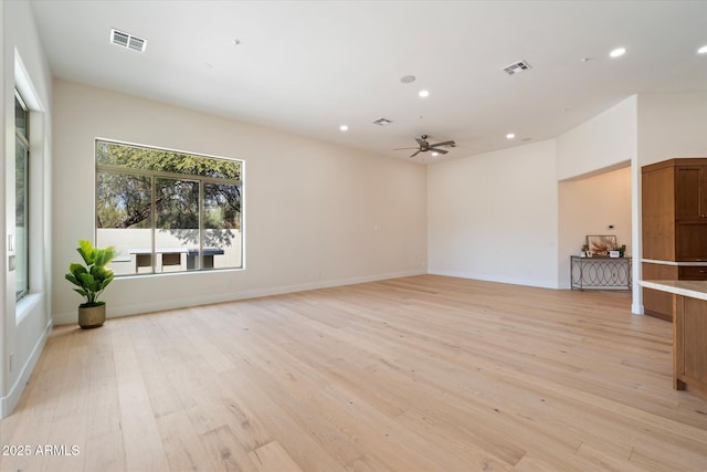 unfurnished living room featuring ceiling fan and light hardwood / wood-style flooring