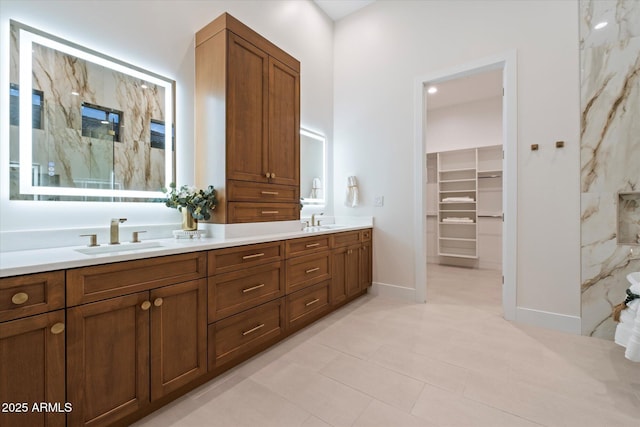 bathroom featuring walk in shower and vanity