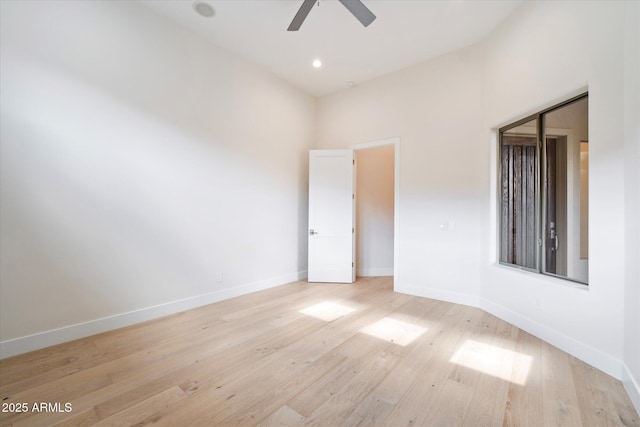 empty room featuring ceiling fan and light wood-type flooring