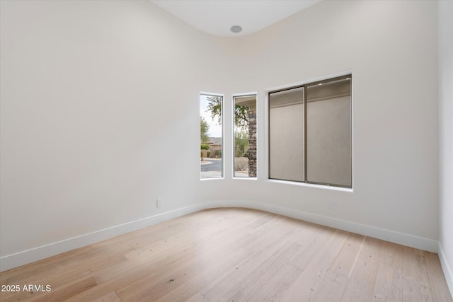 unfurnished room featuring light hardwood / wood-style floors