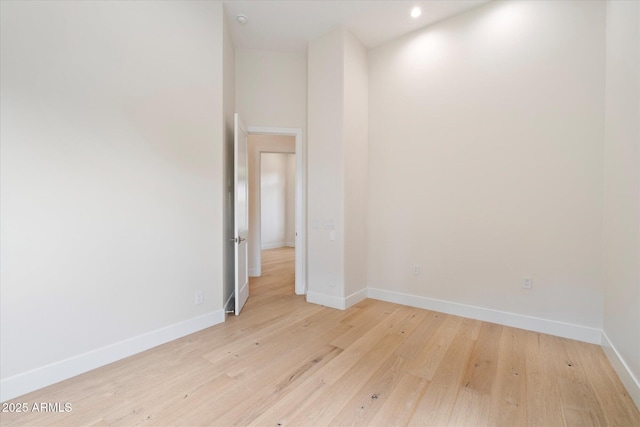 spare room with light wood-type flooring