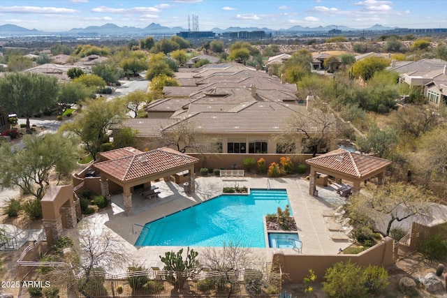 view of swimming pool with a gazebo, a mountain view, and a patio