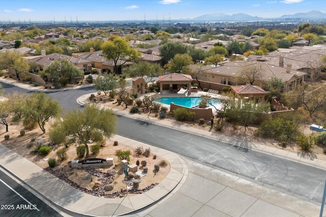 birds eye view of property with a mountain view