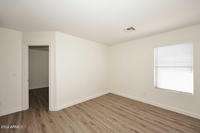 spare room featuring hardwood / wood-style flooring