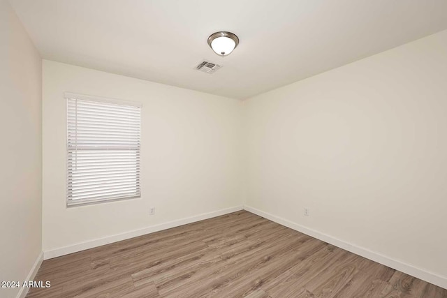 spare room featuring hardwood / wood-style flooring