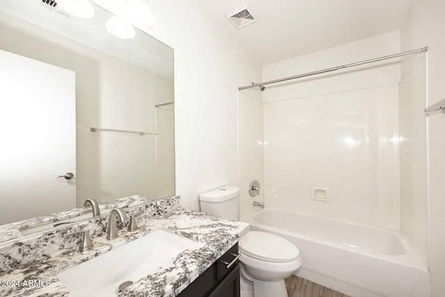 full bathroom with vanity, bathtub / shower combination, and toilet