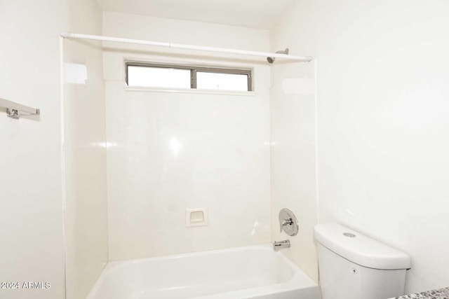 bathroom featuring toilet and shower / tub combination