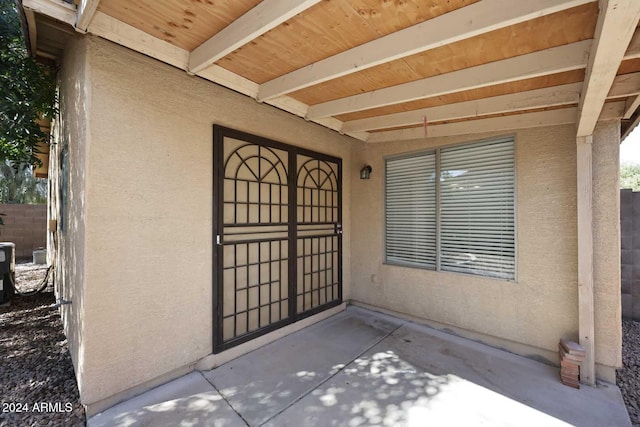 entrance to property with a patio