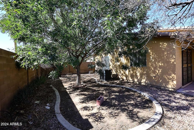 view of yard featuring central AC unit