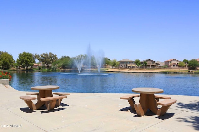 view of swimming pool featuring a water view