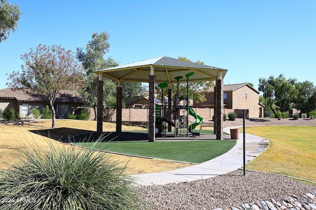 view of community with a playground and a yard