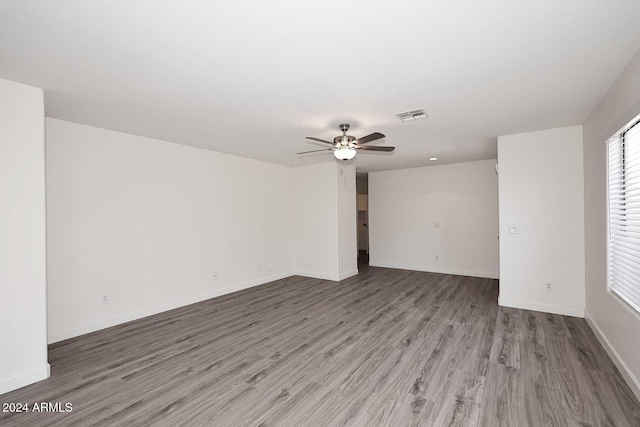 spare room featuring ceiling fan and hardwood / wood-style floors