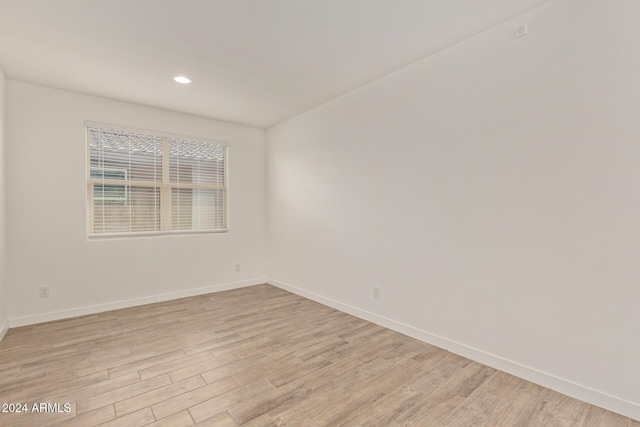 unfurnished room featuring light wood-type flooring