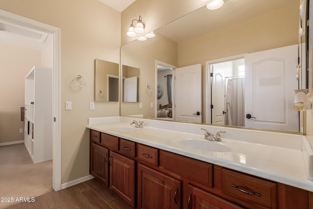 bathroom featuring hardwood / wood-style flooring and vanity